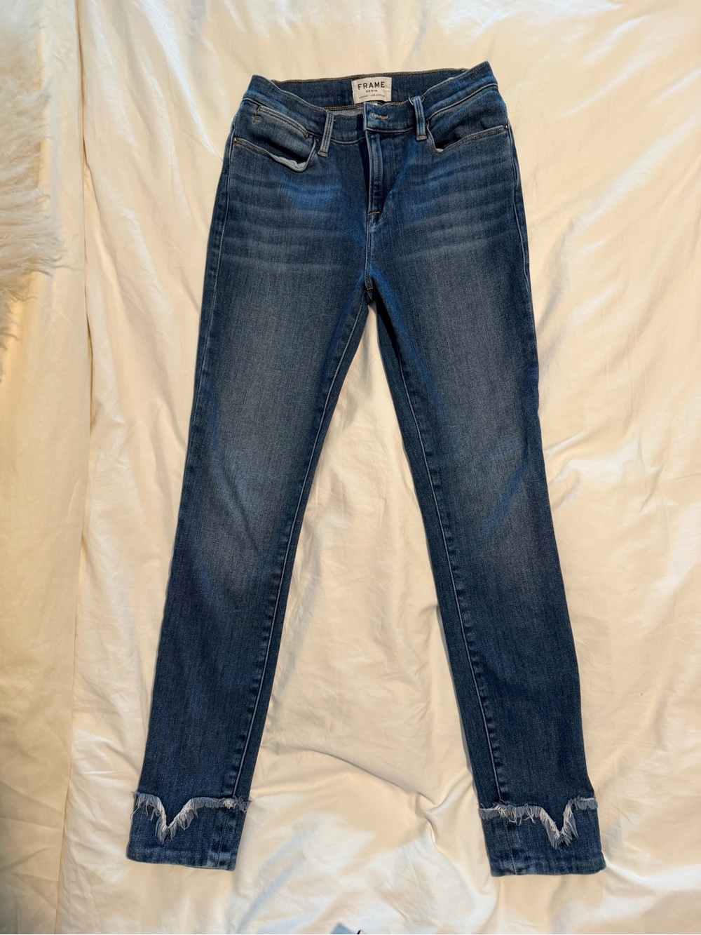 Frame Denim Skinny Jeans in Medium Blue with Frayed Hem
